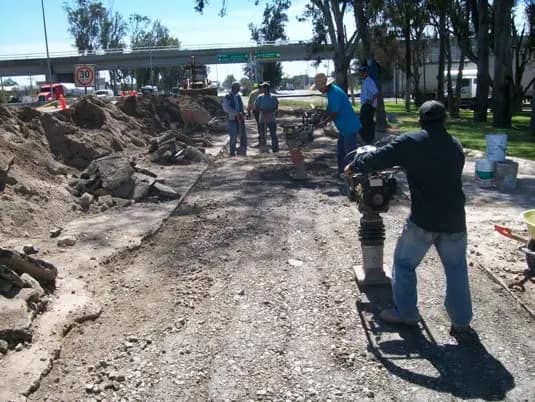 Compacting trench backfill