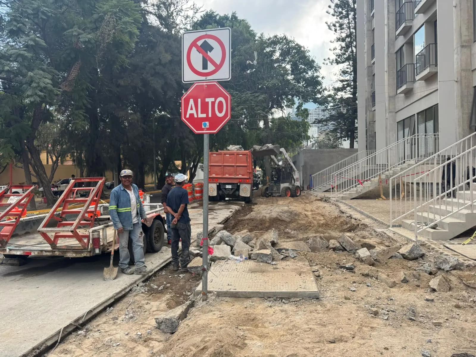 Work front with signage at a crossing