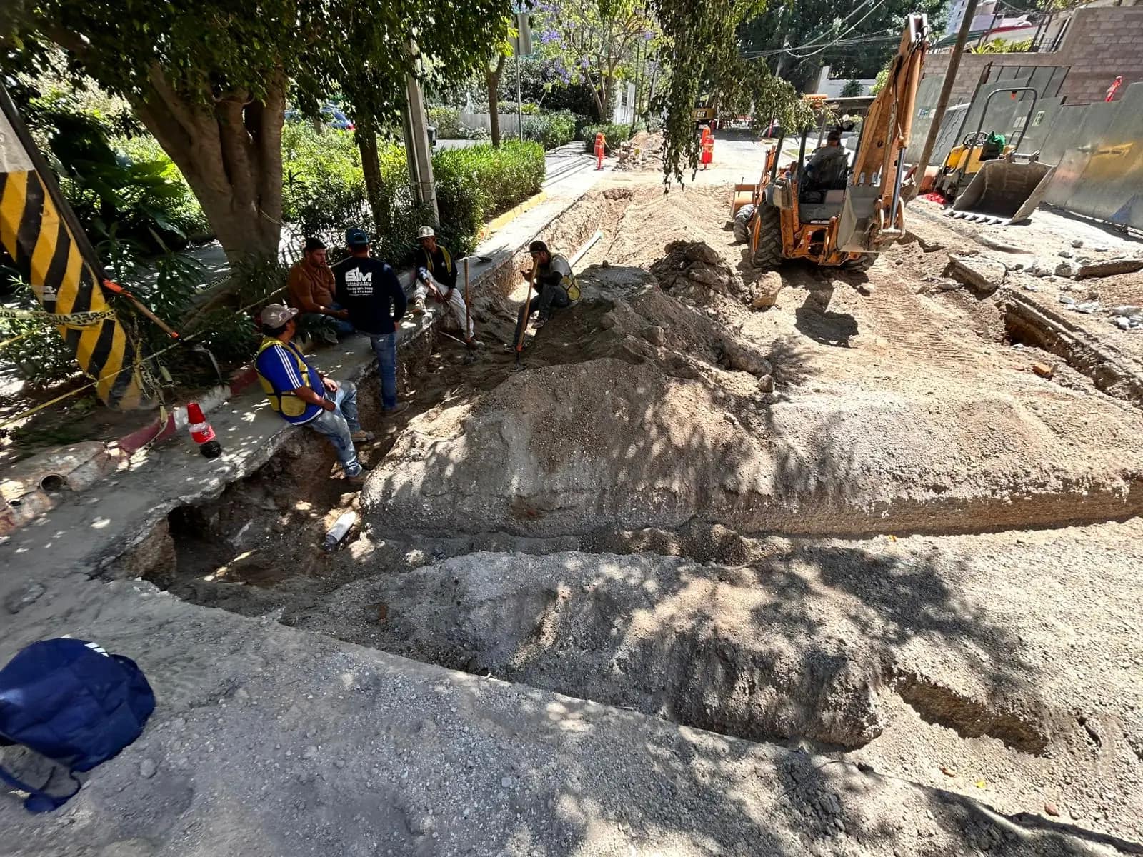Backhoe on a water-network trench