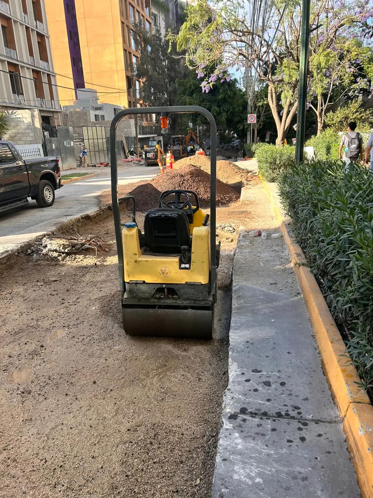 Compacting the base in a trench
