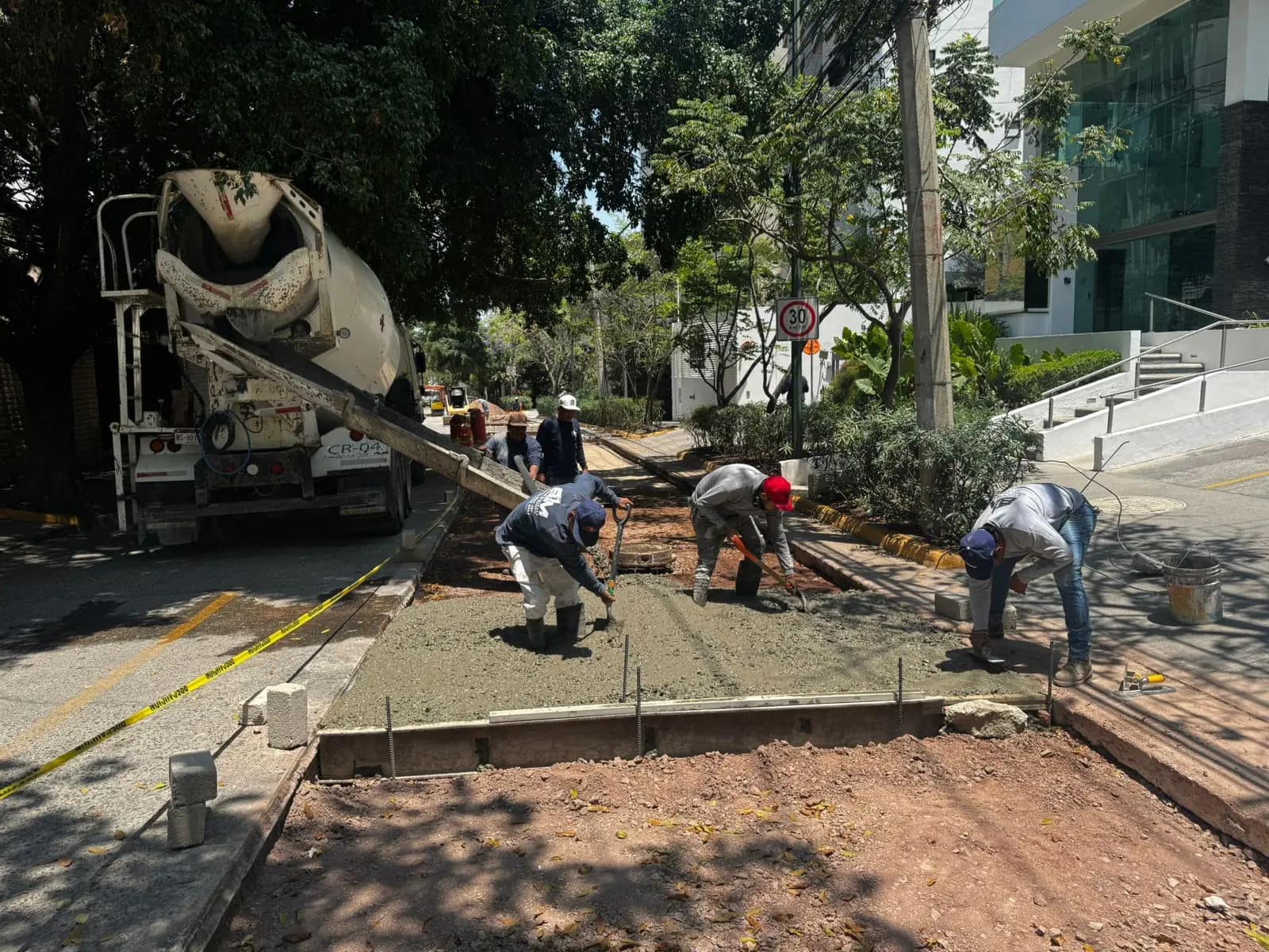 Pouring concrete pavement on a street
