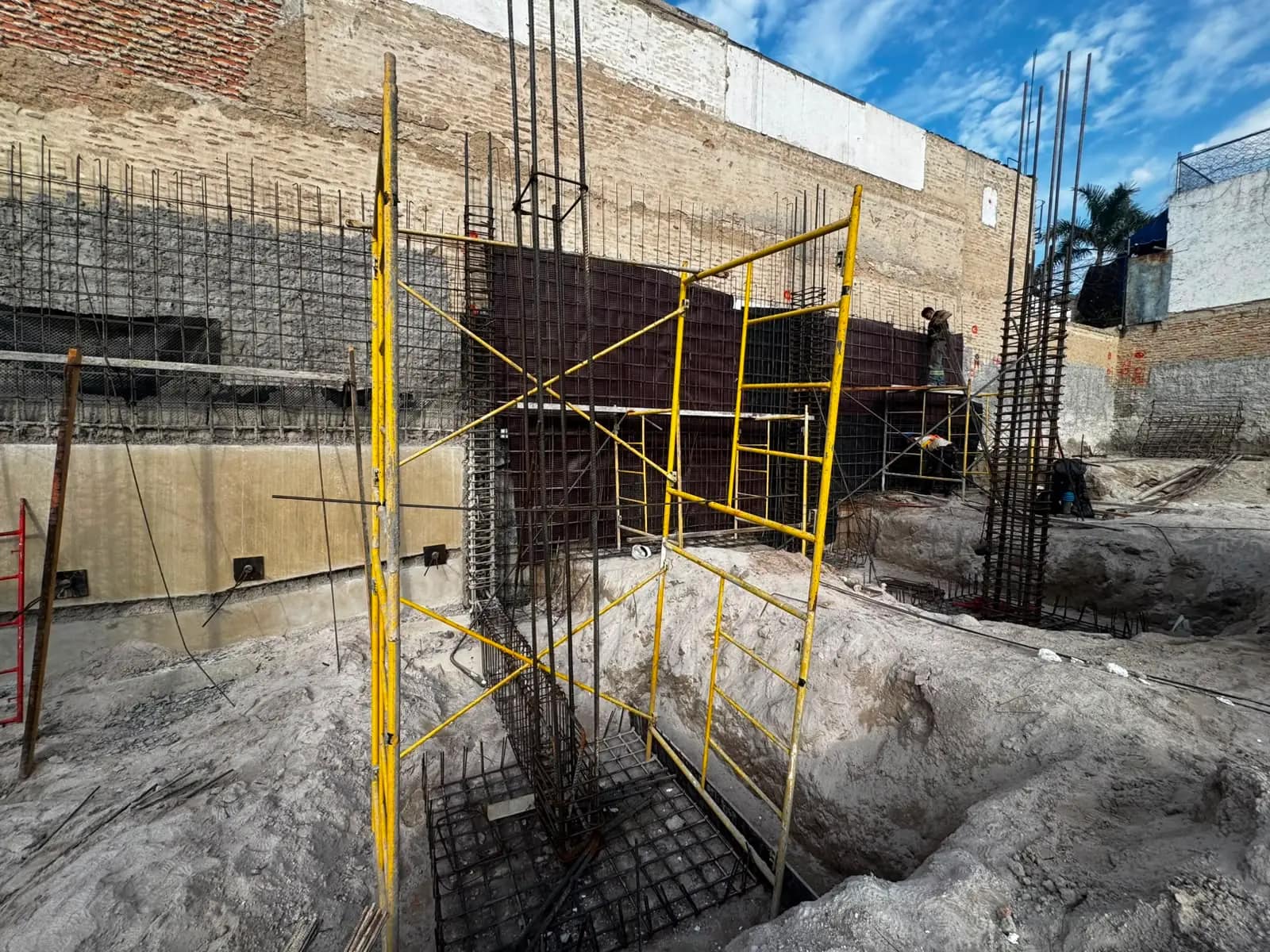 Reinforced columns and shotcrete wall in a basement